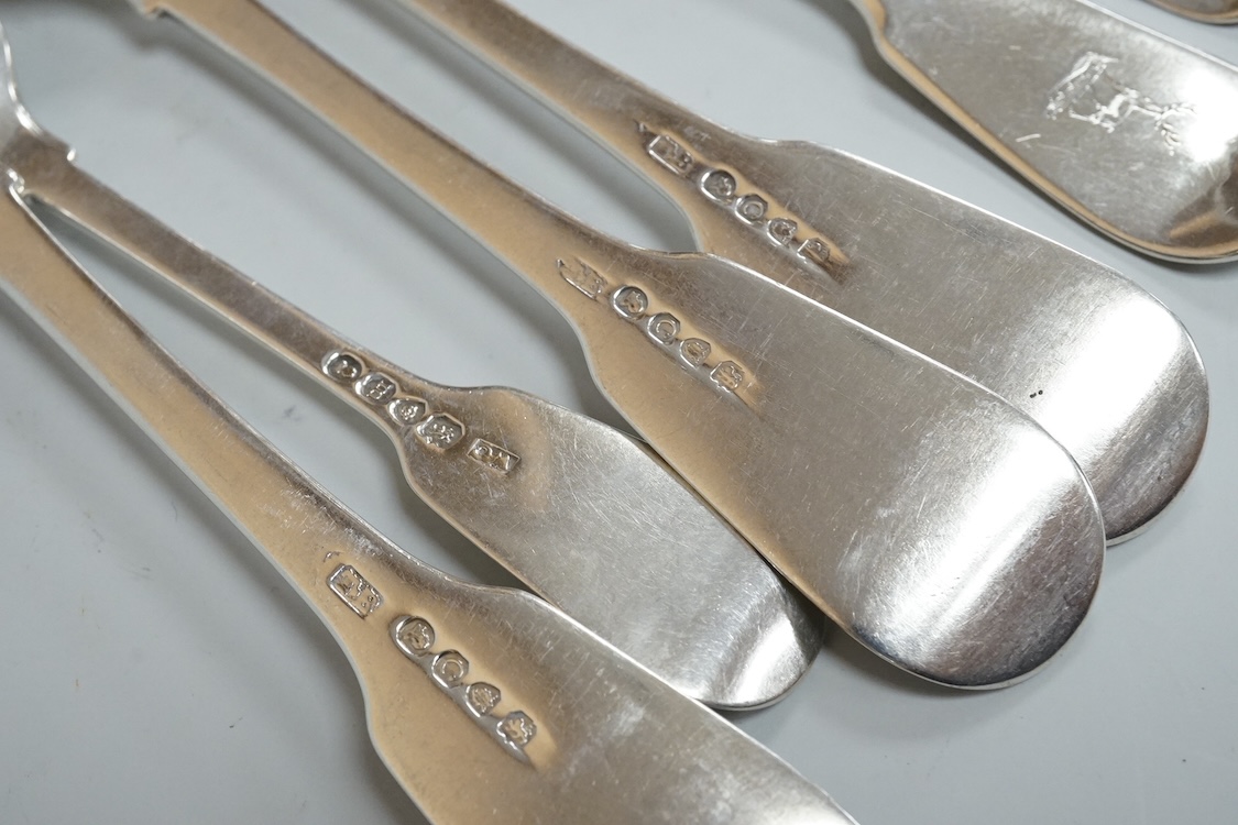A set of six late George III silver fiddle pattern table forks, Thomas Wilkes Barker, London, 1818, together with five 19th century assorted silver fiddle pattern dessert forks, one broken in half, 18.8oz.